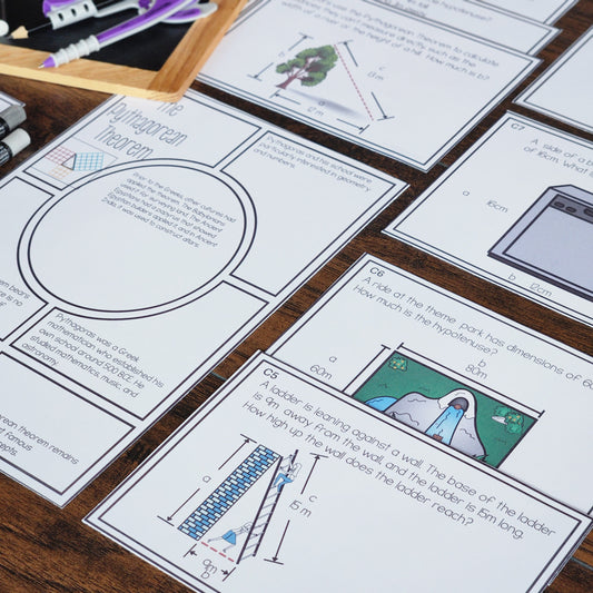 Assorted worksheets and task cards related to Pythagoras' theorem spread out on a table, with writing and illustrations on them.