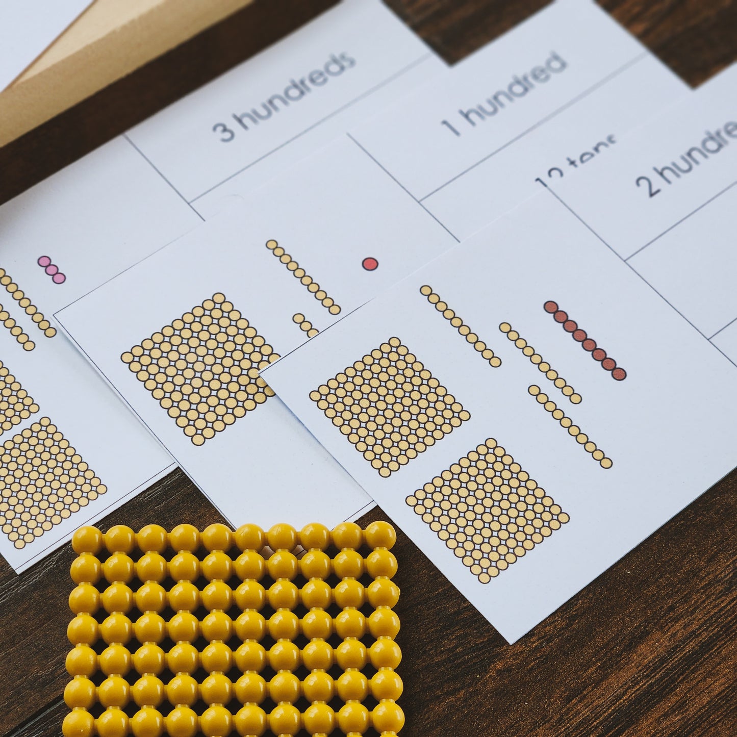 Montessori Place value with golden beads matching cards - montessorikiwi